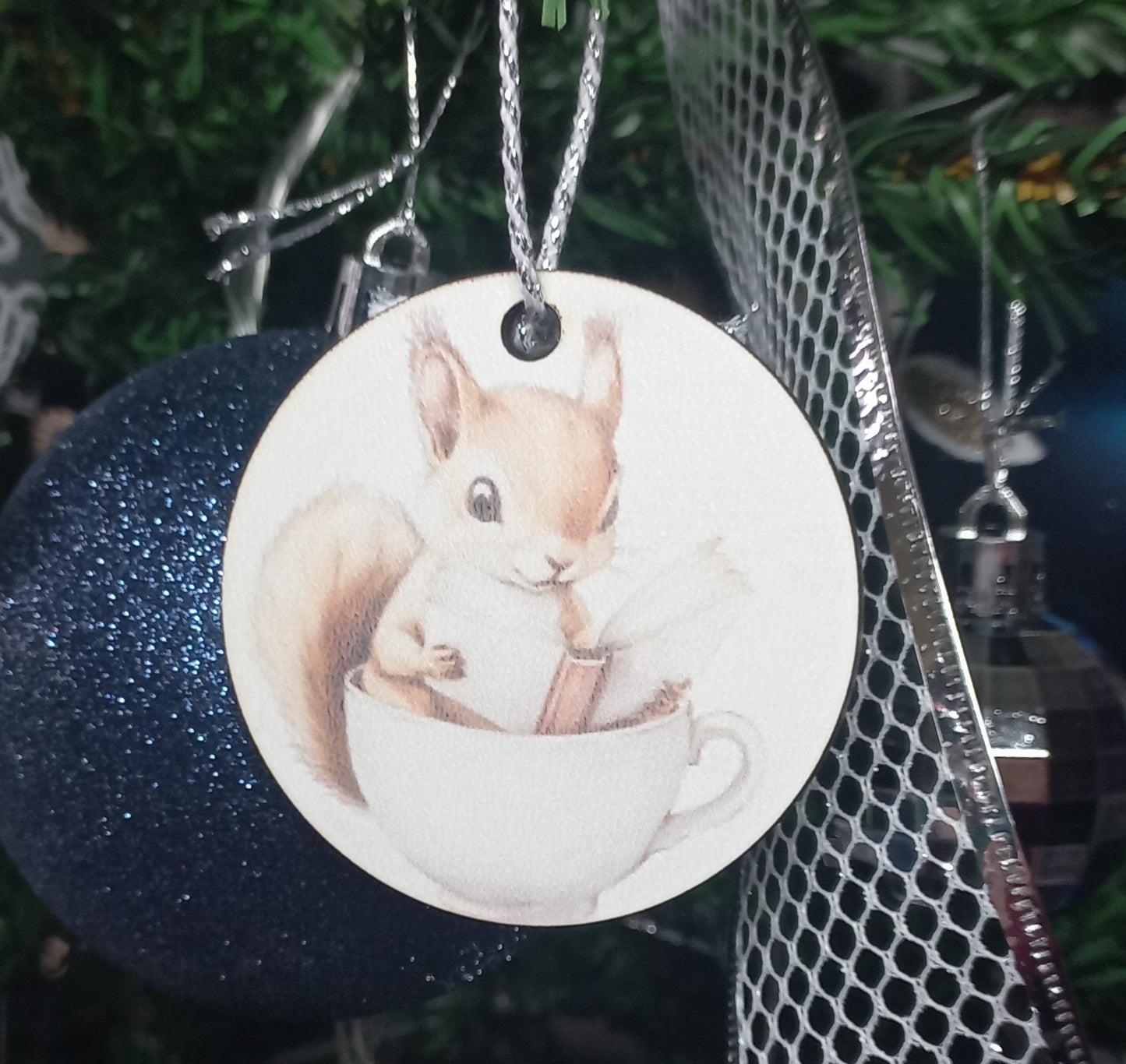 Baby Squirrel Reading A Book In A Teacup